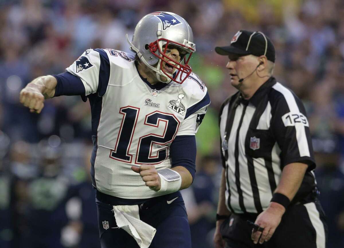 Patrick Semansky — The Associated Press Patriots quarterback Tom Brady (12) celebrates a touchdown against the Seahawks during the first half Sunday.