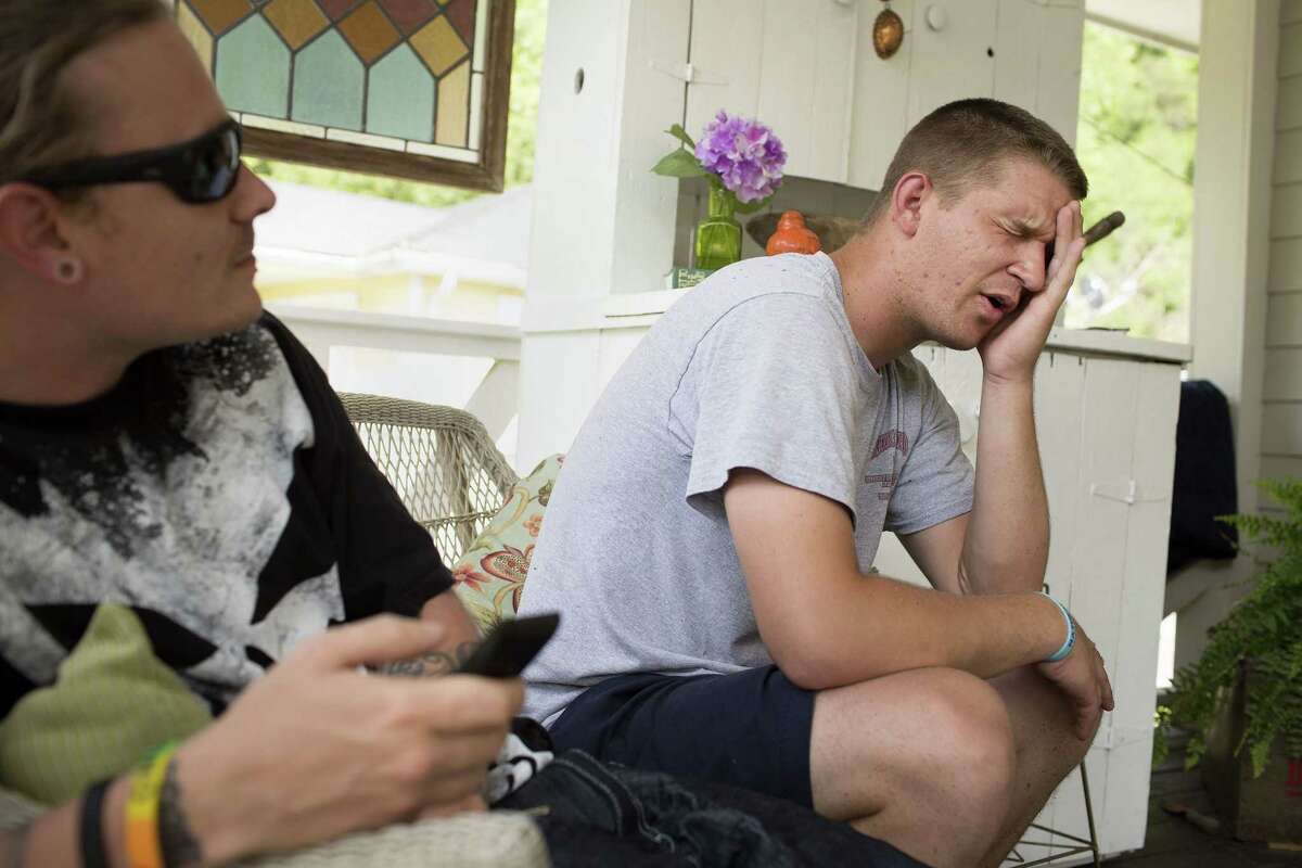 In this May 26, 2015, photo, Patton Couch, who says he was diagnosed with Hepatitis C, talks about his past struggles with using drugs at his home where he lives with his parents in Hazard, Ky. Couch and friend Justin Kennedy, left, are both recovering injection drug users. Public health officials warn that if the region doesn't get the IV drug abuse problem under control, it's likely to see a Hepatitis C or HIV outbreak. (AP Photo/David Stephenson)