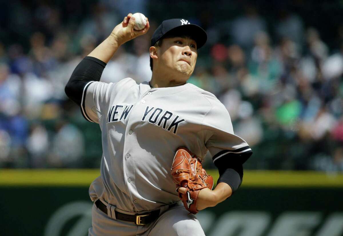 New York Yankees starting pitcher Masahiro Tanaka throws against the Seattle Mariners in a baseball game, Wednesday, June 3, 2015, in Seattle. (AP Photo/Ted S. Warren)