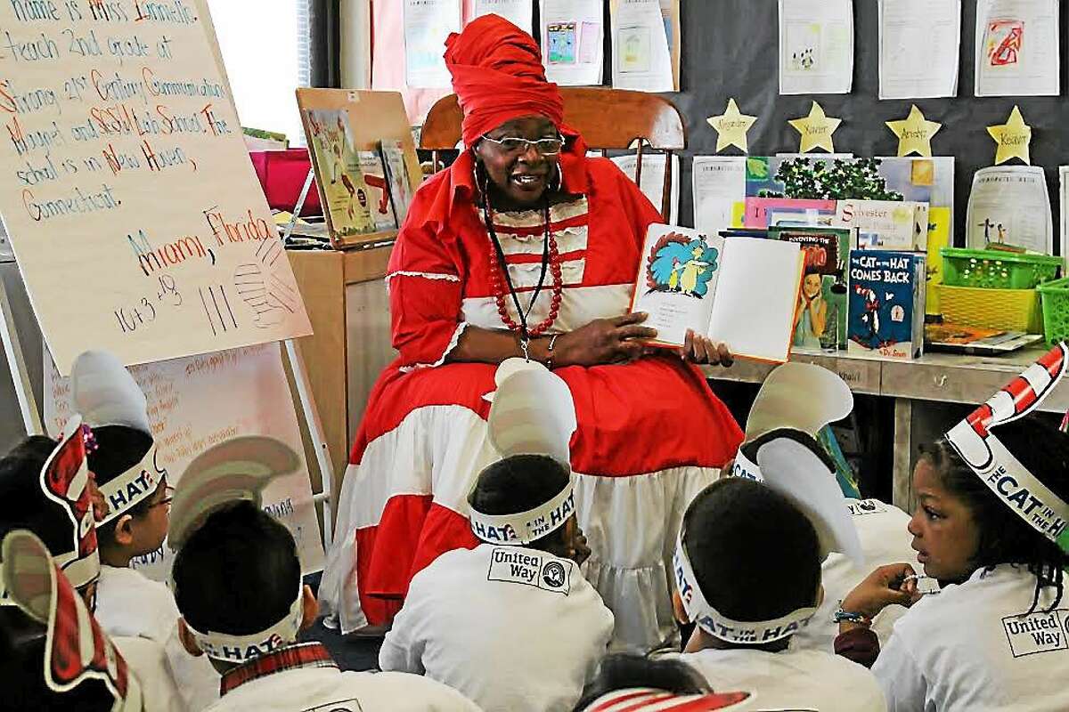 Yale-New Haven Hospital volunteer Janice Hart reads to students Monday.