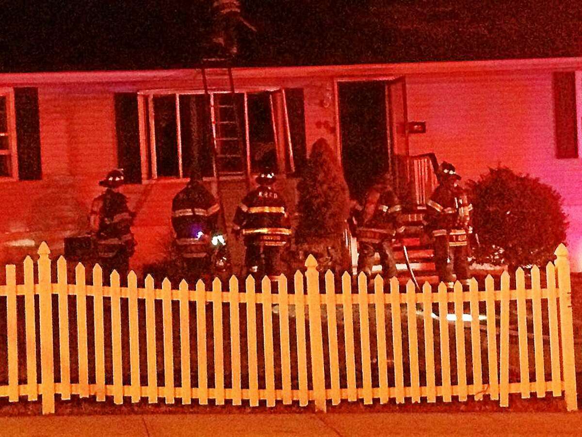 City firefighters battled flames Wednesday night in the basement of a home at 95 Pond Lily Ave. in Amity.