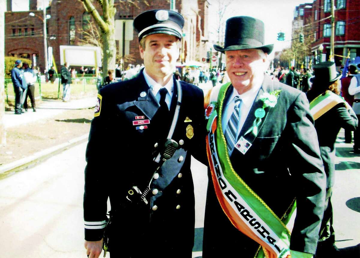 John R. O’Connor, grand marshal of the 1988 Greater New Haven St. Patrick’s Day Parade, is photographed on the parade route with his nephew, New Haven Fire Department Battalion Chief John Shepa. O’Connor will receive West Haven’s Irishman of the Year honor at noon March 17 on the Campbell Avenue side of City Hall.
