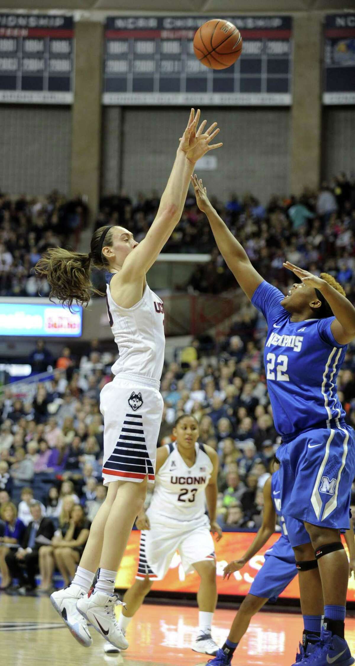 Connecticut's Breanna Stewart (30) shoots over Memphis' Brianna Wright (22) during the first half of an NCAA college basketball game in Storrs, Conn., on Saturday, Feb. 28, 2015. (AP Photo/Fred Beckham)