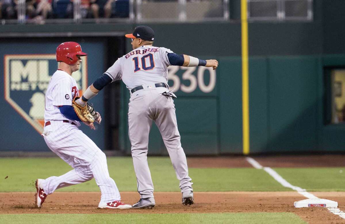 Astros first baseman Yuli Gurriel tags the Phillies' Andrew Knapp to complete a double play on a liner to center in the second inning.