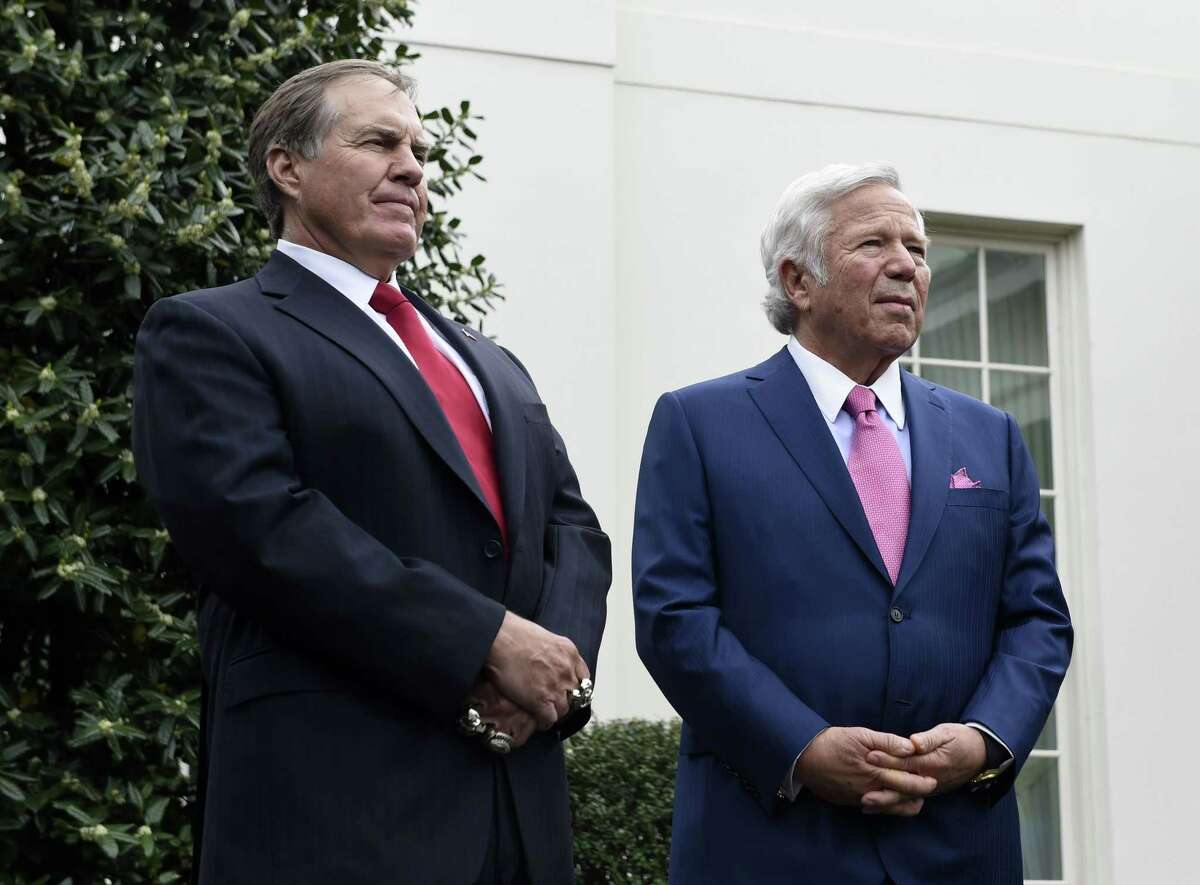 New England Patriots head coach Bill Belichick, left, and team owner Robert Kraft speak to the media outside the White House on Thursday in Washington.
