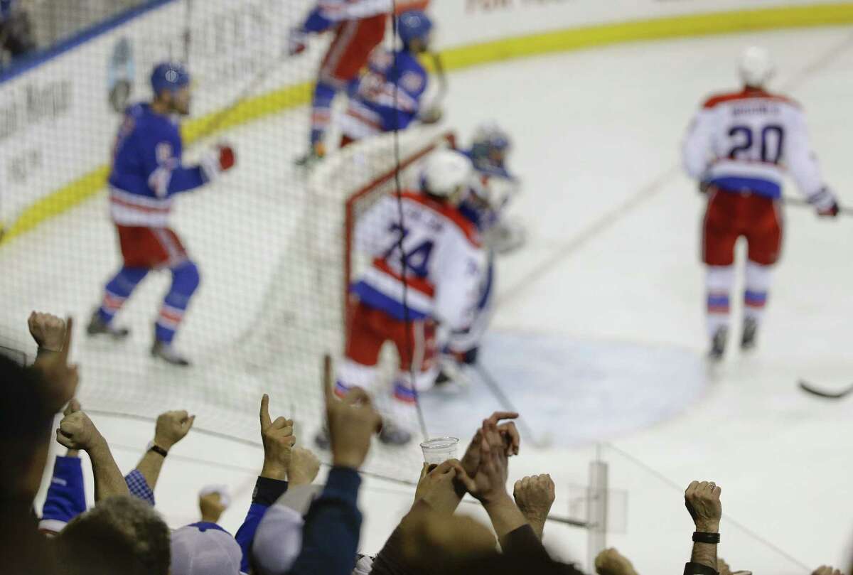 Rangers fans celebrate after a 3-2 win over the Washington Capitals in Game 2 of their second-round series on Saturday in New York.