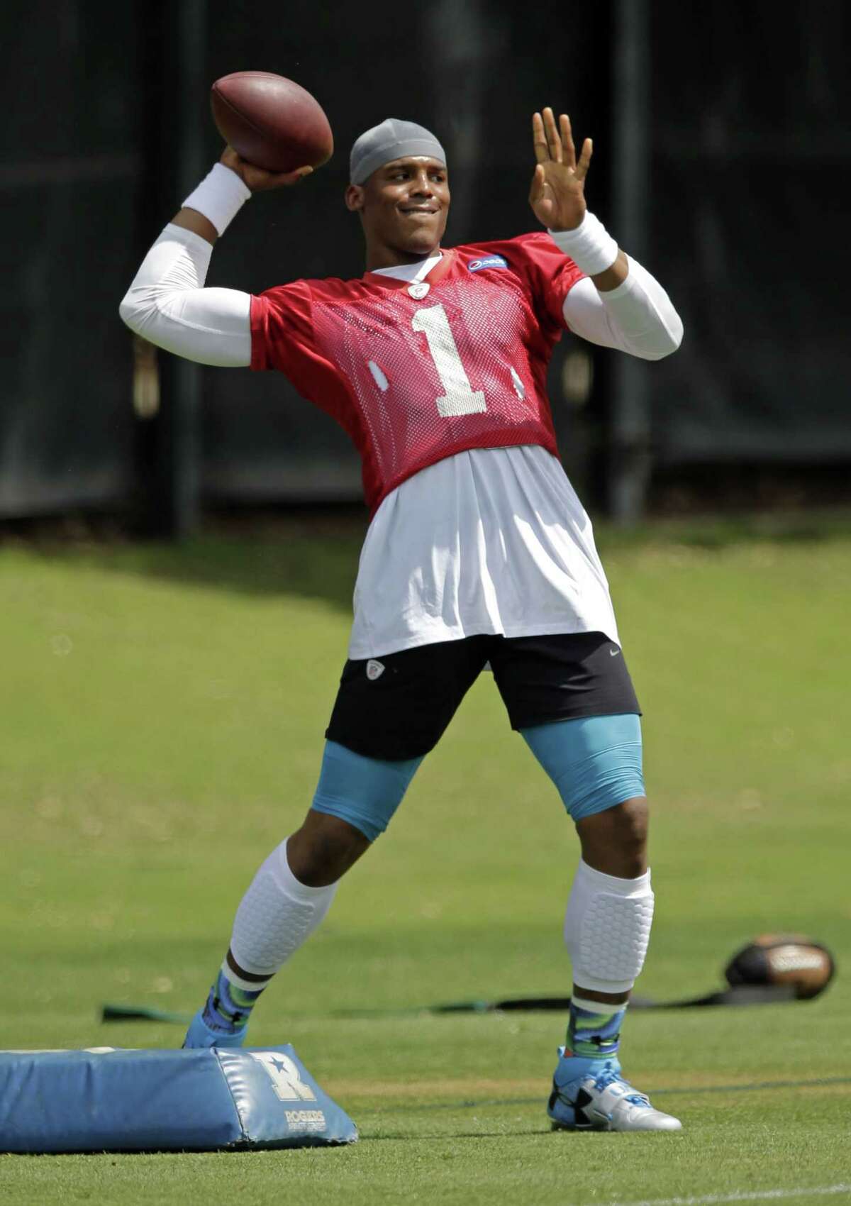 Carolina Panthers quarterback Cam Newton throws a pass during practice Thursday in Charlotte, N.C.