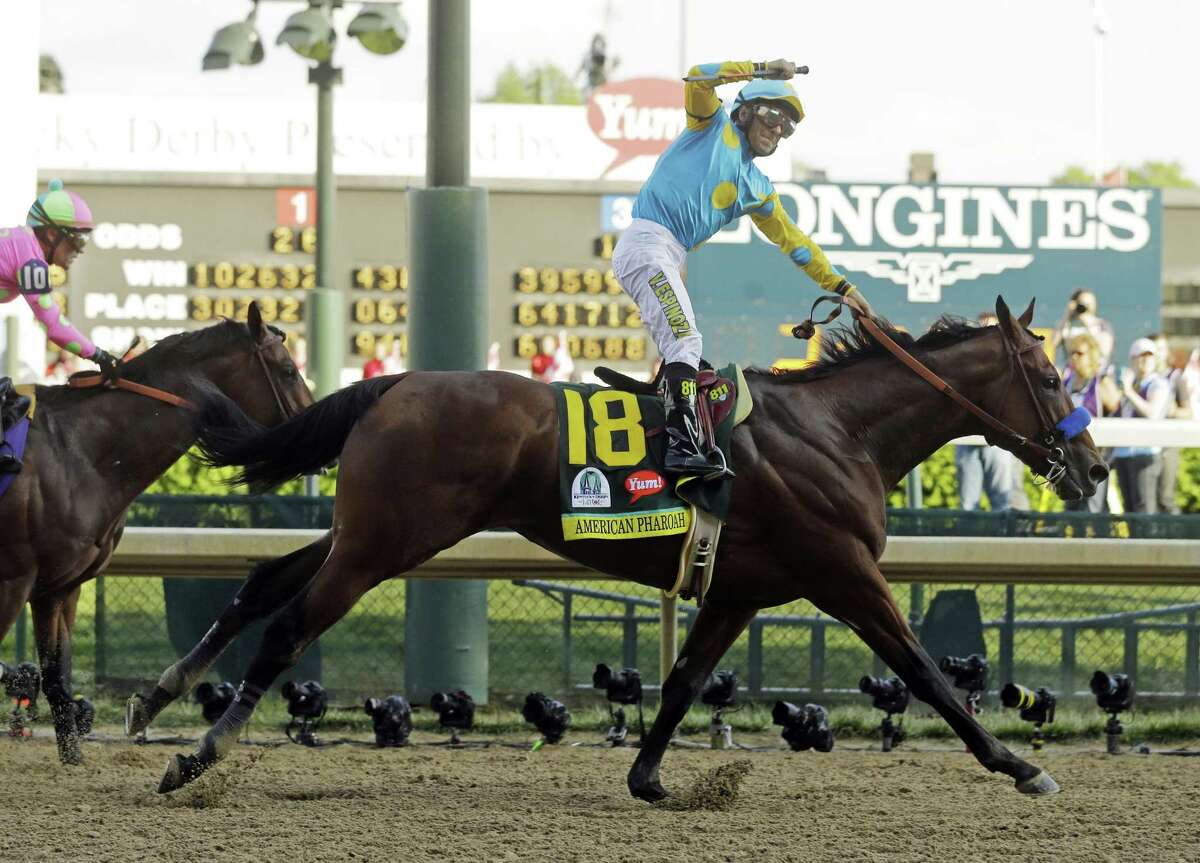Victor Espinoza rides American Pharoah to victory in the 141st running of the Kentucky Derby on Saturday at Churchill Downs in Louisville, Ky.