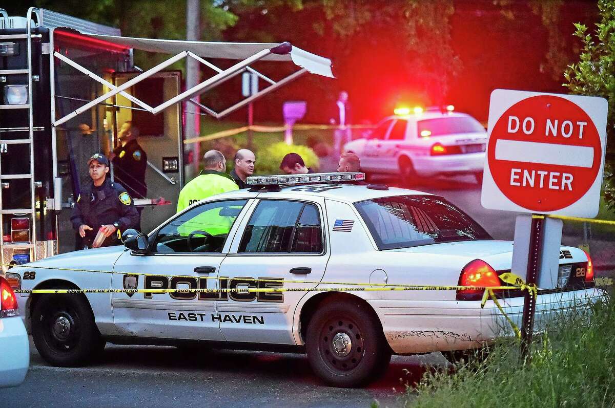 Members of the Connecticut State Police Major Crime Squad and East Haven Police Department at the scene of an East Haven home at 541 Strong St. where two young children were found dead Tuesday.