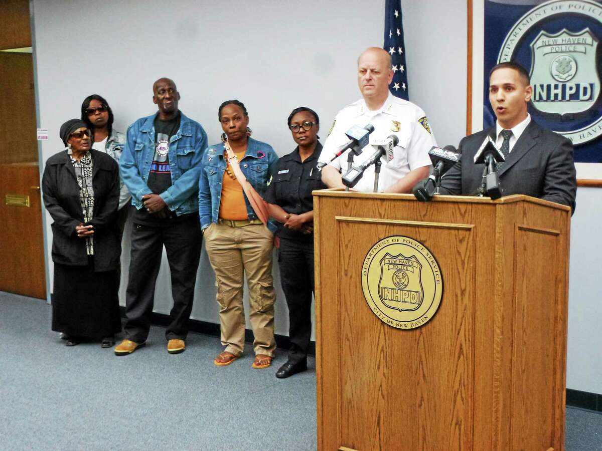 From left, Patricia Emory, aunt of slaying victim Albert Jenkins; Vandala Alton, a friend; Dennis Jenkins, uncle of the victim; Shantel Jenkins, the victim’s sister; police Officer Jillian Knox; police Chief Dean Esserman; and Sgt. David Zannelli at a press conference Monday in New Haven.