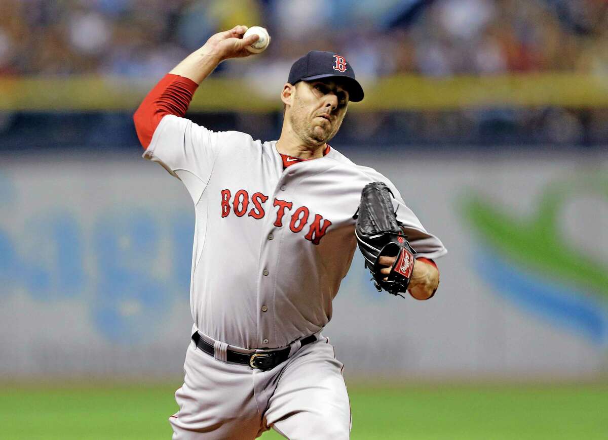 The Boston Red Sox traded pitcher John Lackey on Thursday.