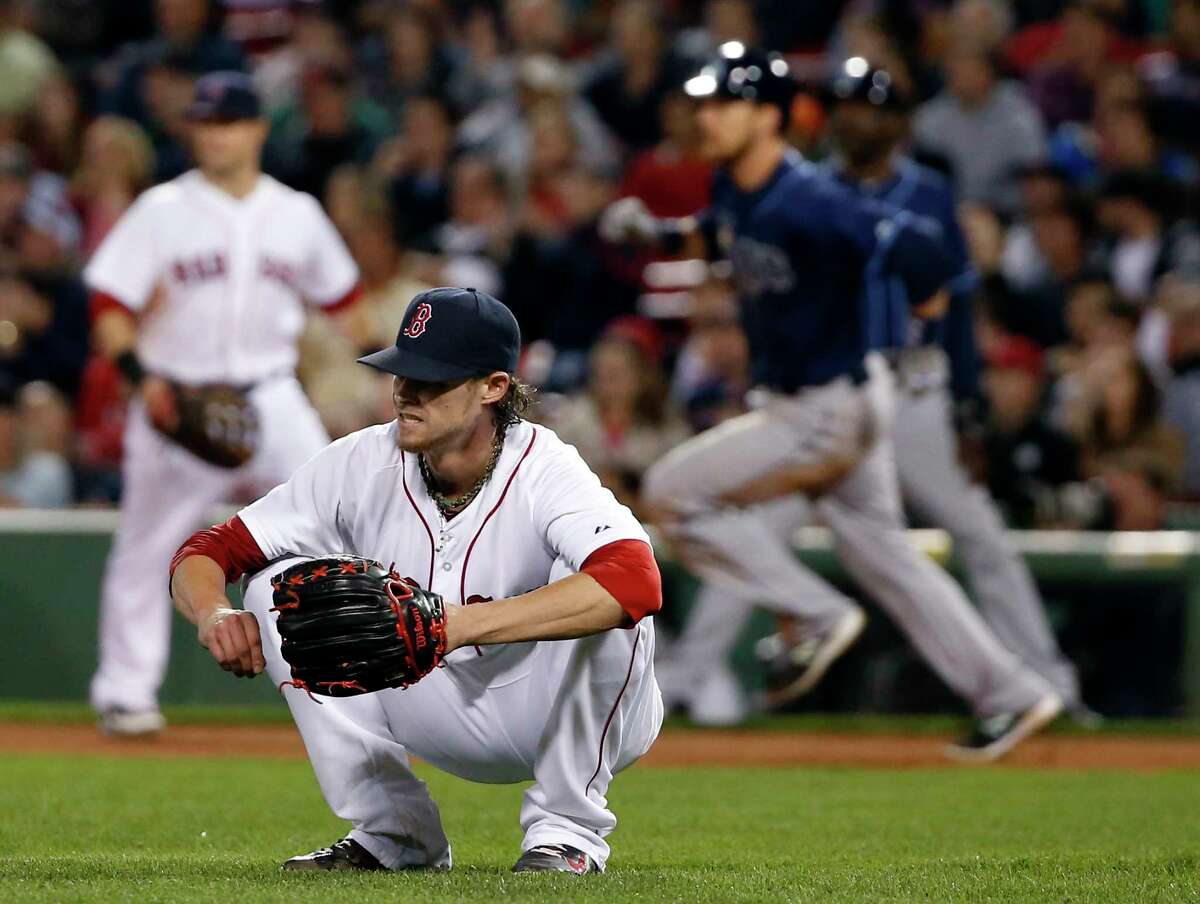 Red Sox starting pitcher Clay Buchholz reacts after giving up a two-run double to the Tampa Bay Rays’ Ben Zobrist in the eighth inning of a Sept. 23 game at Fenway Park in Boston.