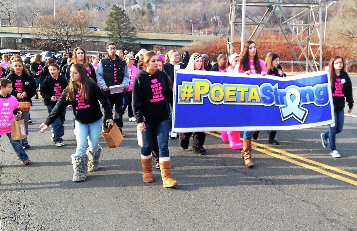 Youths from Seymour Pink march in the Seymour Christmas Parade Sunday.