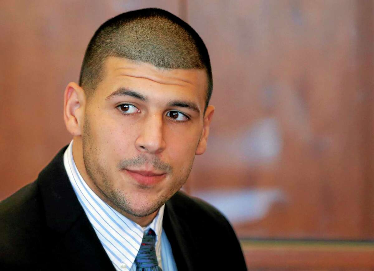 FILE - In this Oct. 9, 2013 file photo, former New England Patriots NFL football player Aaron Hernandez attends a pretrial court hearing in Fall River, Mass. Hernandez has pleaded not guilty in the killing of 27-year-old Odin Lloyd, a semi-professional football player from Boston who was dating the sister of Hernandez's girlfriend. On Monday, Dec. 16, 2013, Lloyd's family filed a wrongful death suit against Hernandez in court in New Bedford, Mass. (AP Photo/Brian Snyder, Pool, File)