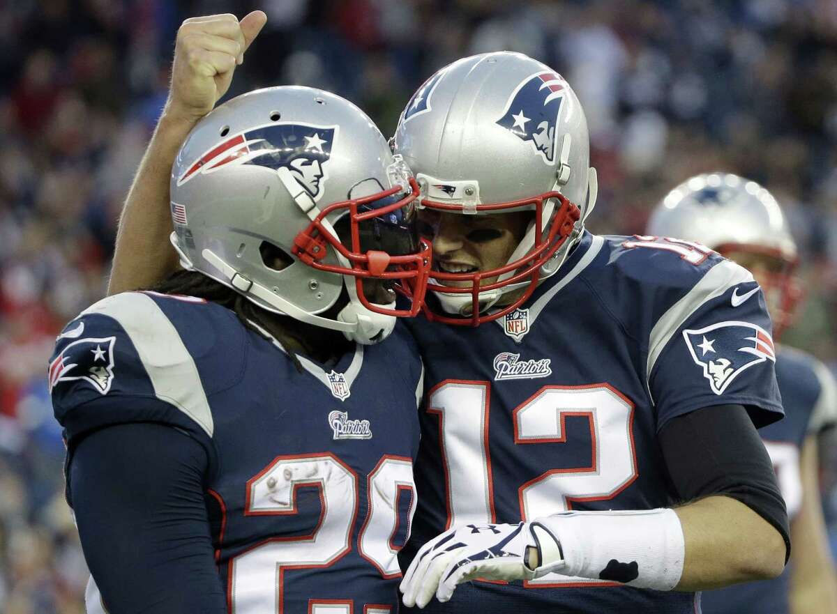 Tom Brady (12), LeGarrette Blount and the New England Patriots are underdogs Sunday in Lambeau Field against the Green Bay Packers.