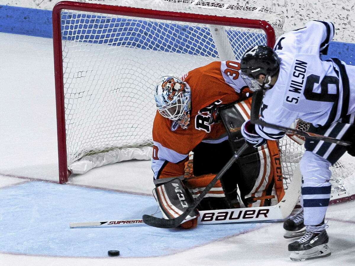 Yale’s Stu Wilson takes a shot during the Bulldogs’ 2-0 win over RIT on Saturday.