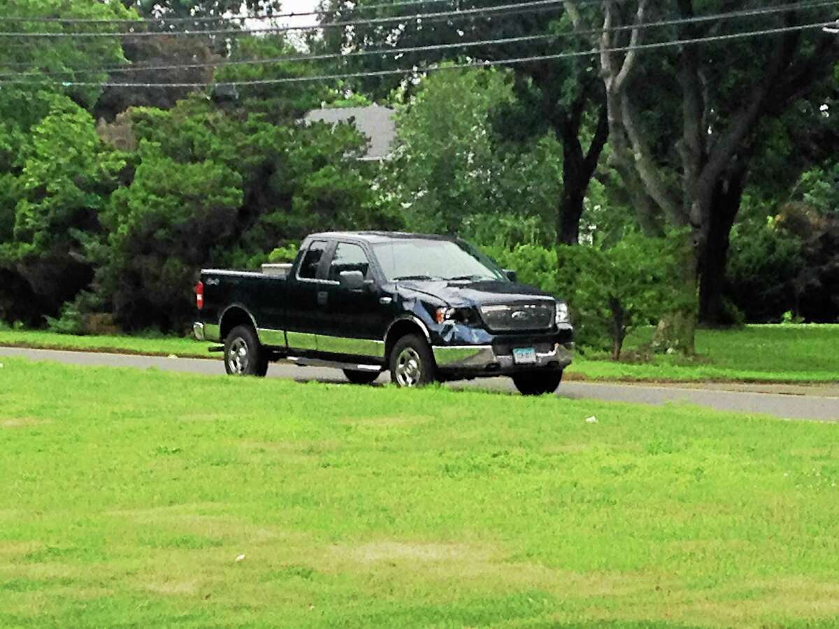 A pickup truck police said was driven by Theodore Spalding, 72, at the scene of an accident in North Haven on Middletown Avenue on July 16. John Liquori, 20, was struck by the truck and killed, police said.