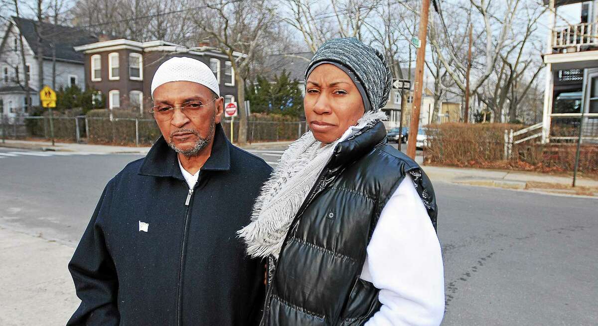 (Peter Casolino-New Haven Register) Abdul-Karim Sharif and his wife, Tahirah Sharig. have lived on Butler Street for 13 years. They saw the shooting death of Taijhon Washington last week on this spot.