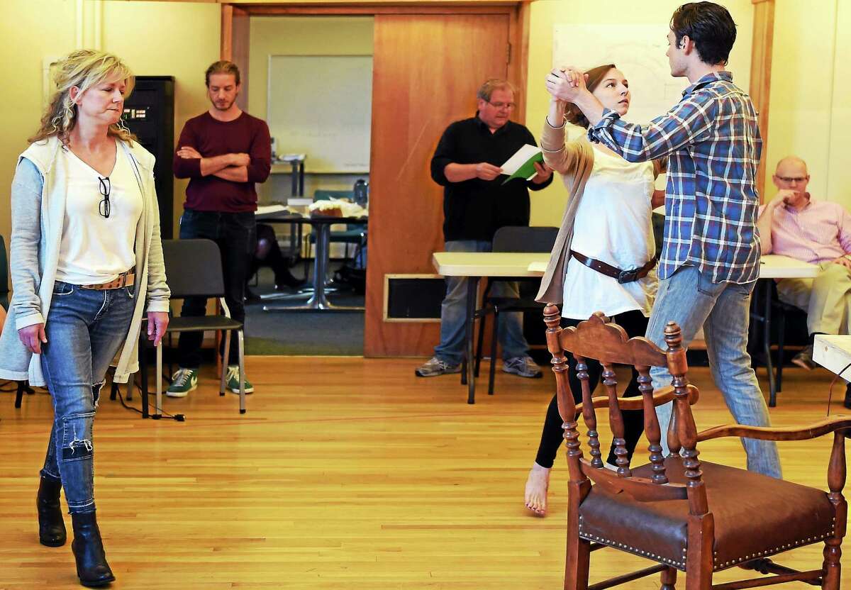From left, Rene Augesen as Hannah Jarvis, assistant director Luke Harlan, stage manager James Mountcastle, Rebekah Brockman as Thomasina Coverly, Tom Pecinka as Septimus Hodge and director James Bundy, far right, participate in a rehearsal of Tom Stoppard’s play “Arcadia” last week. The show will premiere Friday at Yale Rep.