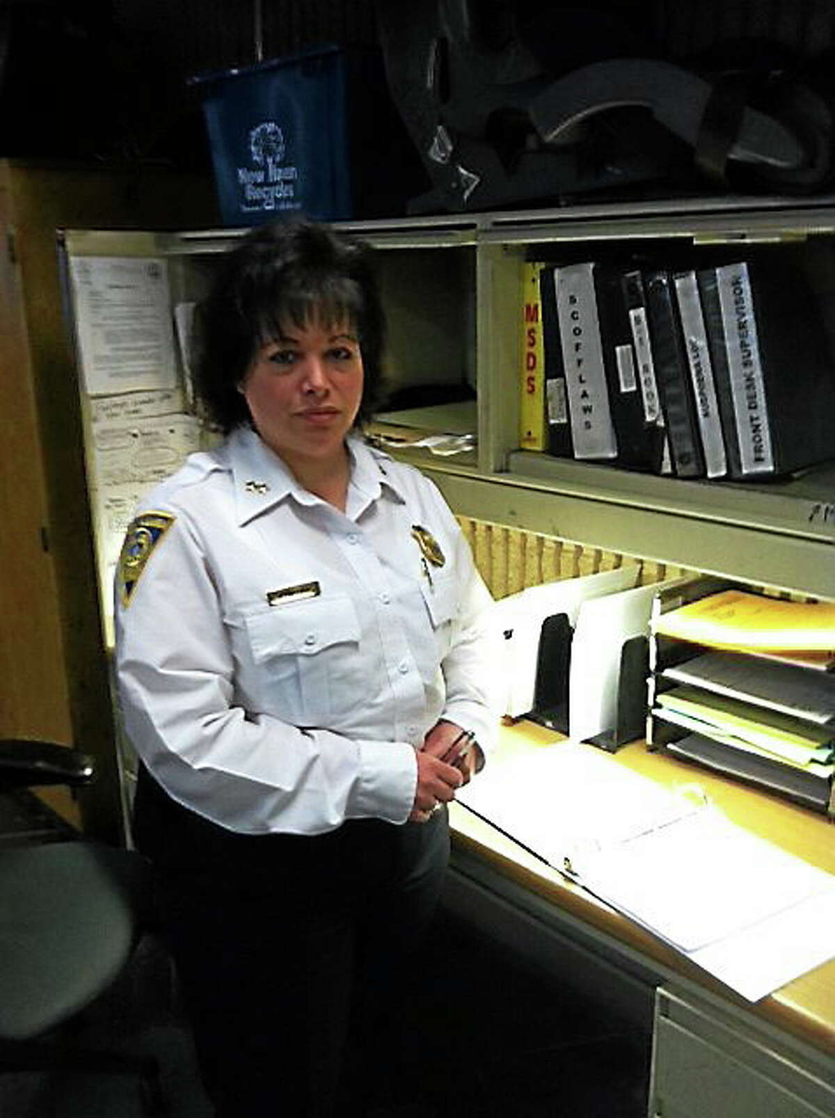 New Haven police have an arrest log now available for the public to review, after they failed a Freedom of Information compliance check conducted by staff at the New Haven Register and sister newspapers. Assistant Chief of Police Denise Blanchard stands next to the new arrest log. It is available for viewing 24 hours a day, seven days a week. (Michelle Tuccitto Sullo — New Haven Register)