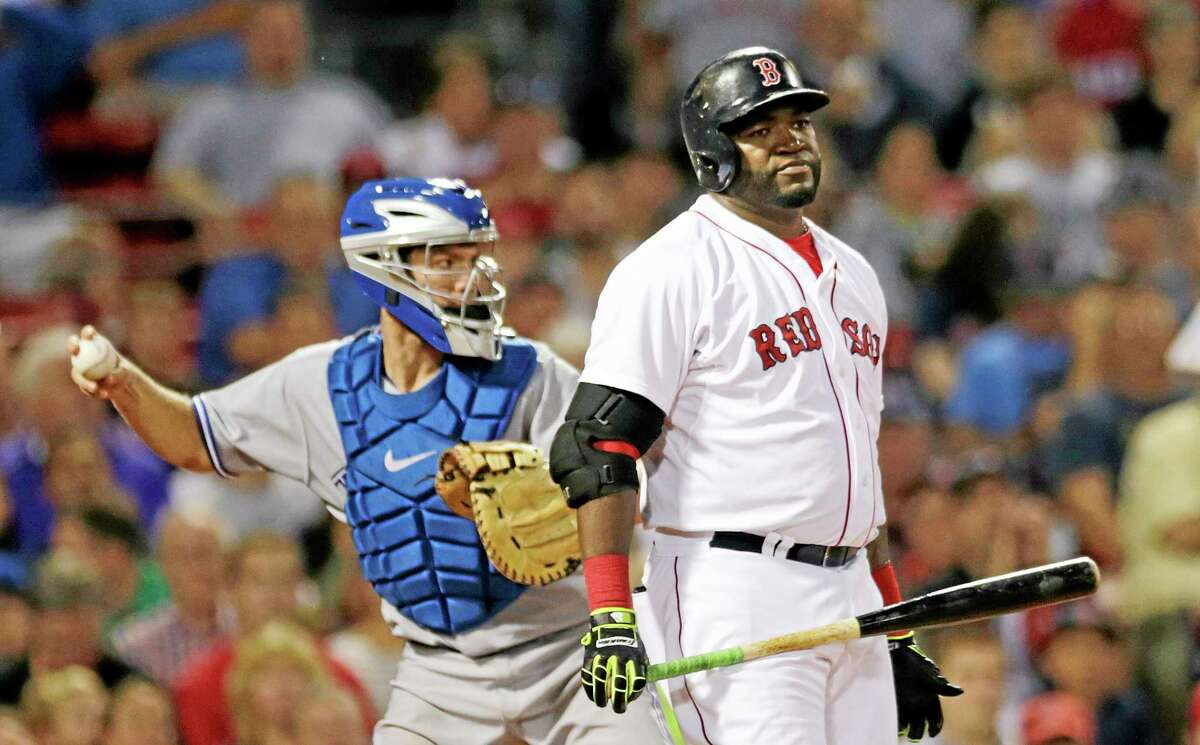 Boston Red Sox designated hitter David Ortiz reacts after striking out against Toronto Blue Jays starting pitcher R.A. Dickey in the fourth inning Monday. The Red Sox 14-1.