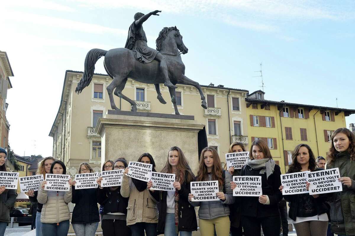 Students of Casale Monferrato show placards reading, in Italian, “Eternit: how many time will we be killed again?” during a protest in Casale Monferrato, northern Italy, recently.