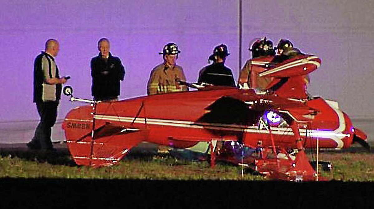 A pilot was extricated after his single-seater plane inverted upon landing at Simsbury Airport on Saturday night, trapping him inside.