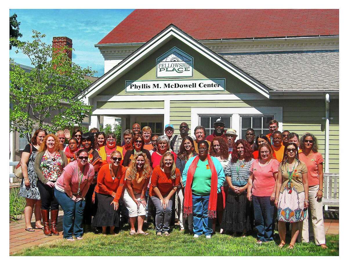 A group photo of Fellowship Place members and staff in front of the McDowell Center on campus, named in honor of agency’s founder, Phyllis McDowell.