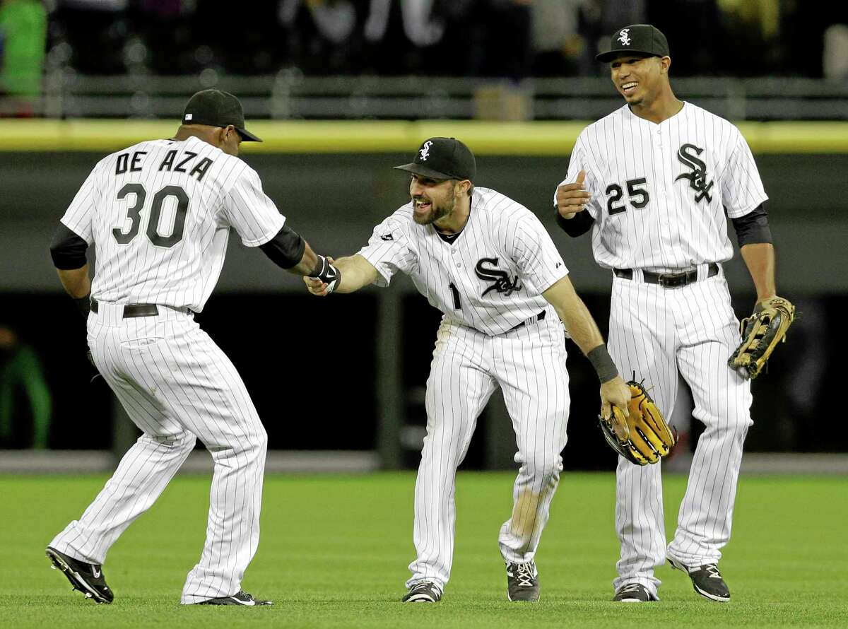 Chicago White Sox center fielder Adam Eaton, center, celebrates with left fielder Alejandro De Aza, left, and right fielder Moises Sierra after the White Sox defeated the New York Yankees 3-2.
