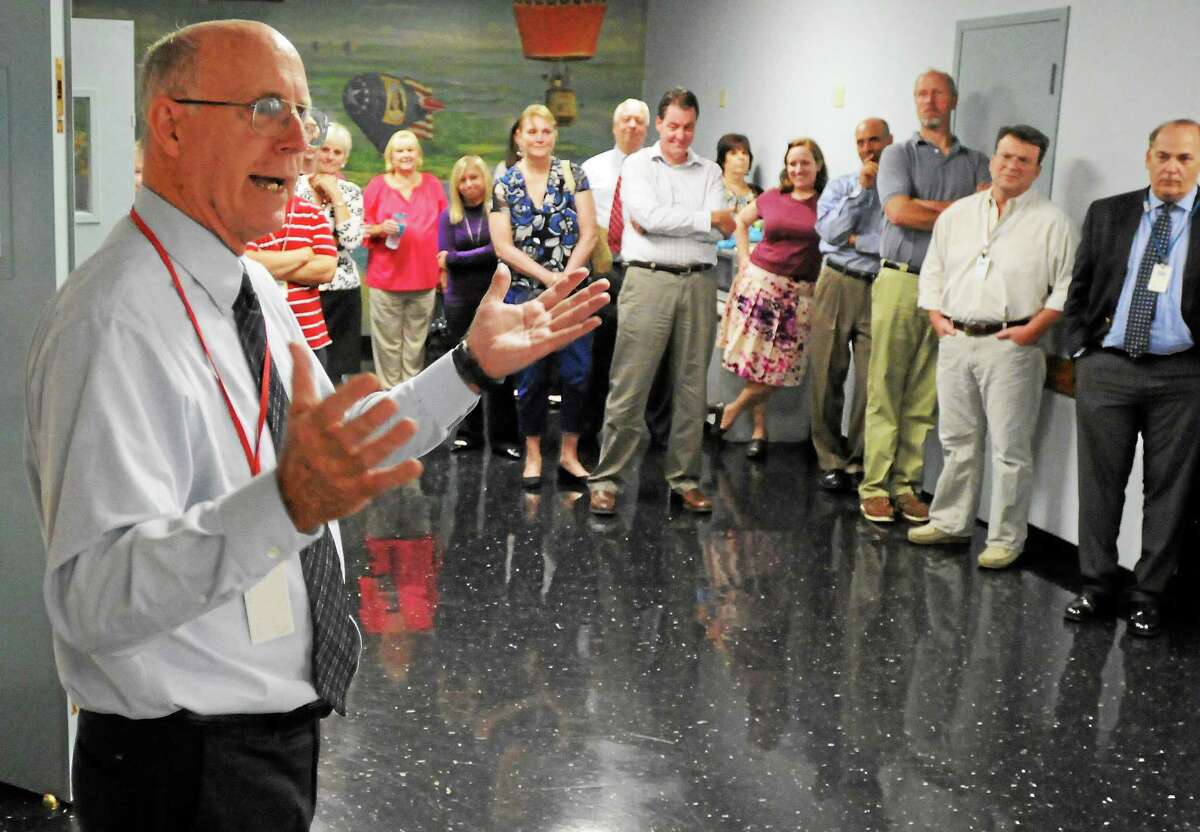 Bob Lee, New Haven Register director of Human Resources, speaks during a surprise party in his honor celebrating his 45th anniversary with the news organization September 18, 2012.