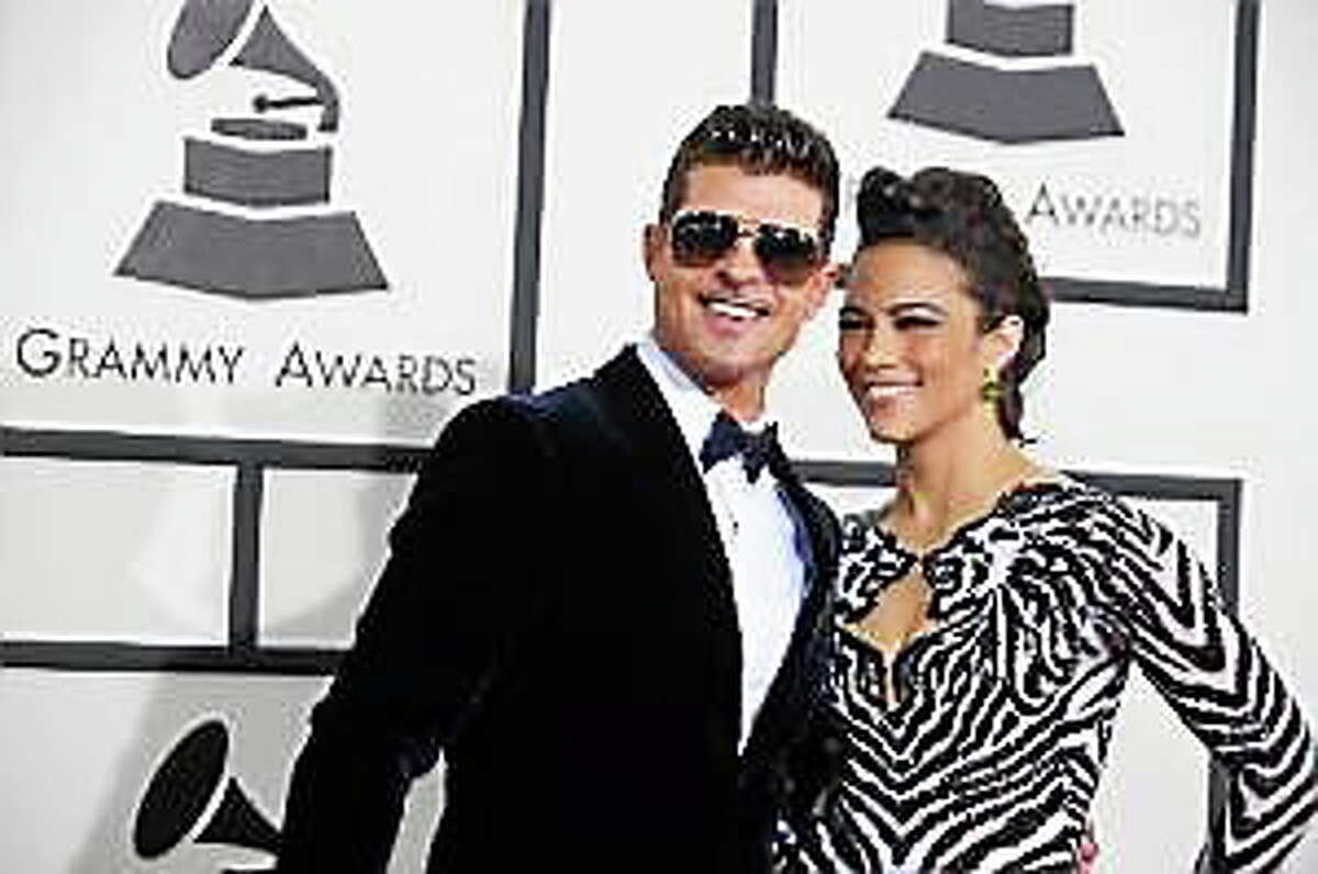 Robin Thicke and Paula Patton arrive at the 56th annual Grammy Awards at Staples Center on Sunday, Jan. 26, 2014, in Los Angeles.