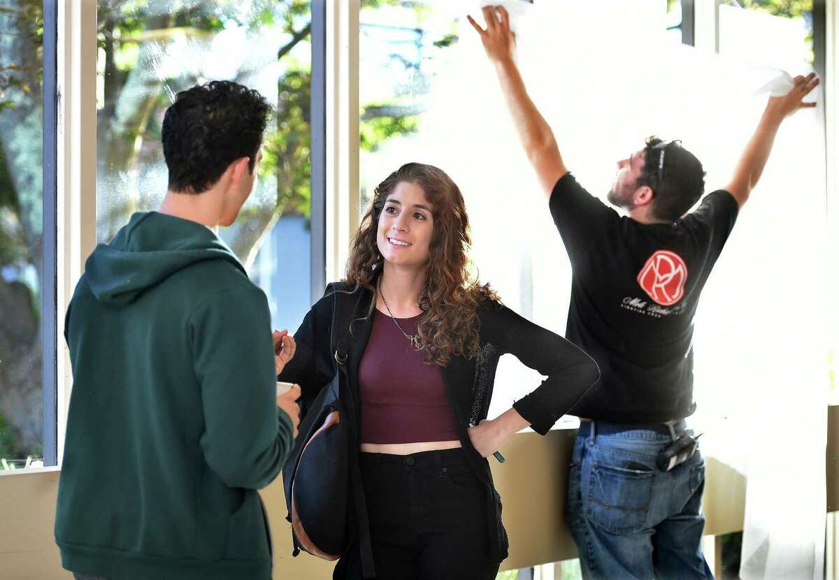 Victoria Negri, an actress, writer, director and Orange native, discusses the next scene while the film crew adjusts the lighting during the filming of “Gold Star” Monday at Gaylord Hospital in Wallingford.