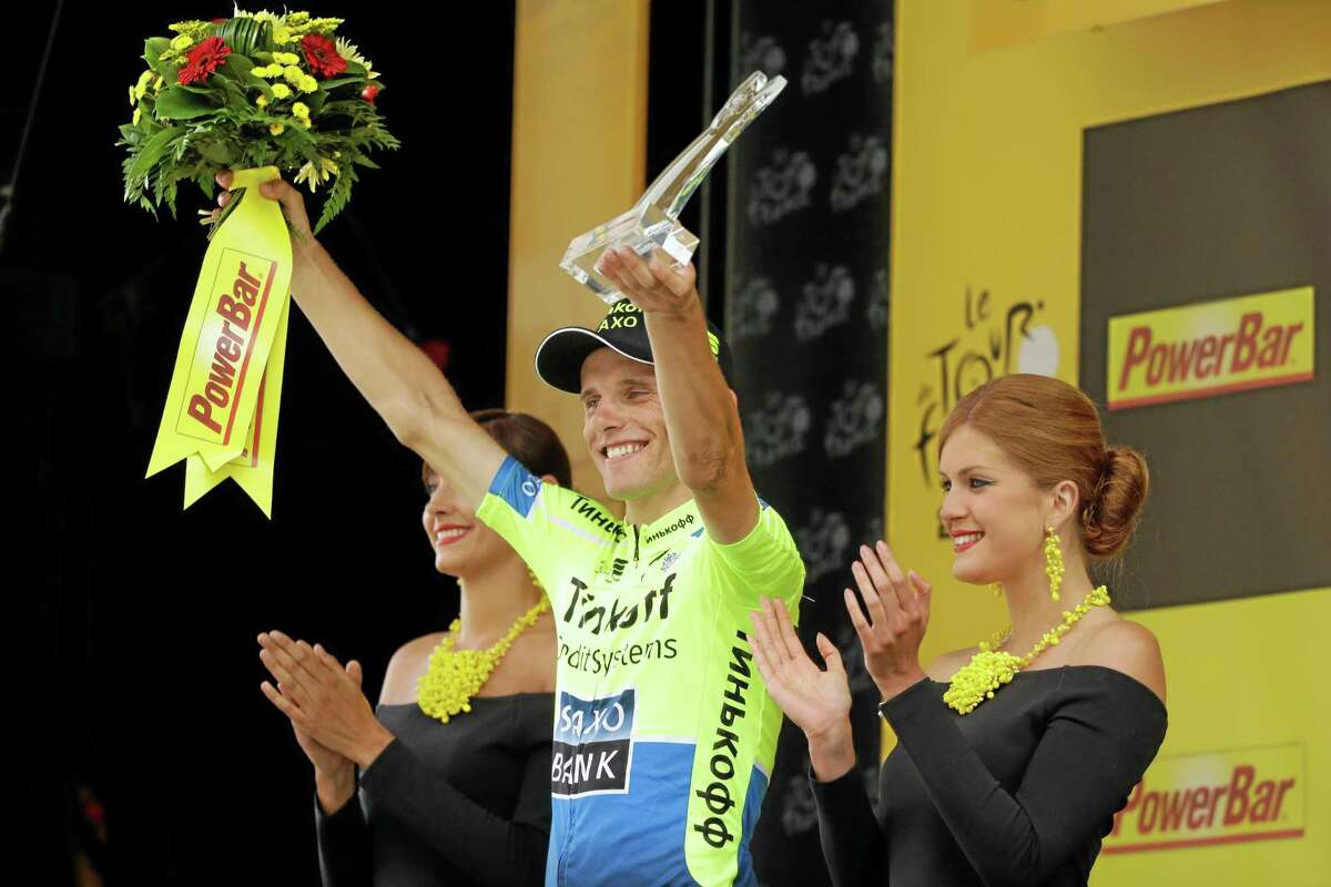 Stage winner Rafal Majka celebrates on the podium of Wednesday’s seventeenth stage of the Tour de France, which went from Saint-Gaudens to Saint-Lary, France.