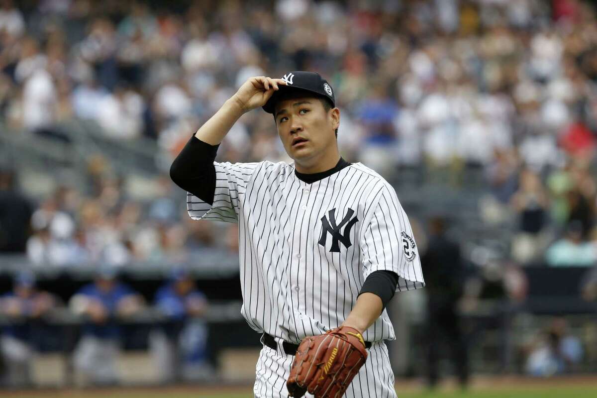 Yankees starting pitcher Masahiro Tanaka tips his cap as he leaves the game during the sixth inning Sunday.