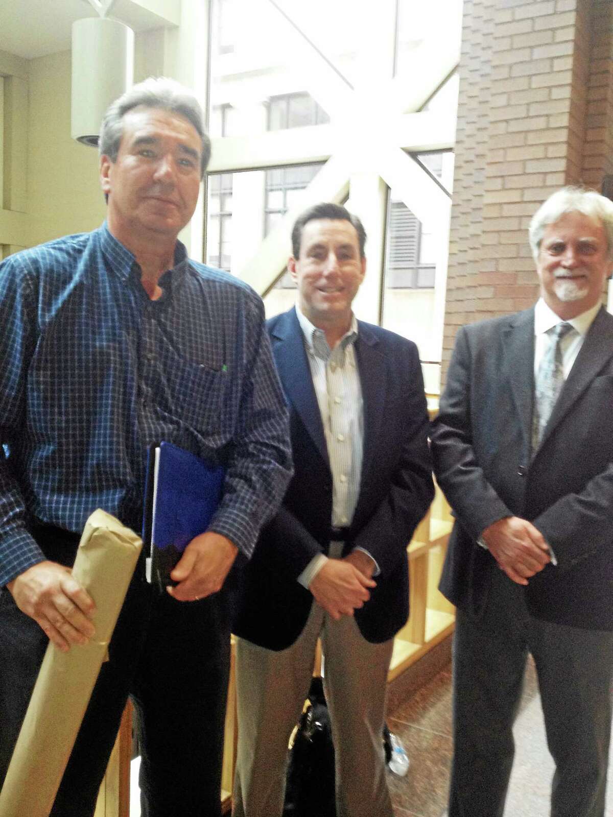 Rick Bolognese, production director; Kevin Corrado, publisher; and Stephen Furnstahl, architect, after site plan approval by the City Plan Commission.