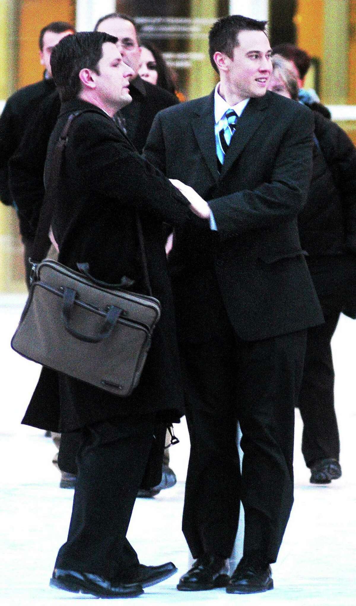 Former East Haven police Officer Dennis Spaulding, right, leaves federal court in Hartford Thursday after being sentenced to 5 years in prison.