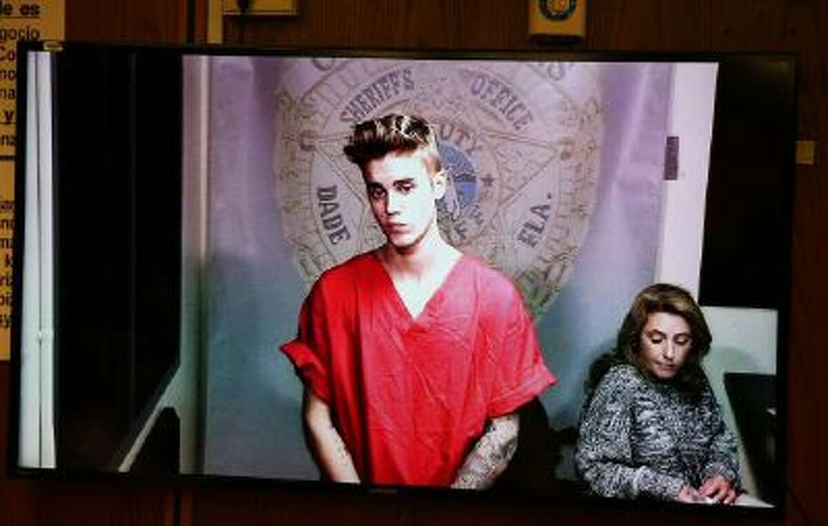 Justin Bieber appears in court via video feed, Thursday, Jan. 23, 2014, in Miami. Bieber was released from jail Thursday following his arrest on charges of driving under the influence, driving with an expired license and resisting arrest. Police say they stopped the 19-year-old pop star while he was drag-racing down a Miami Beach street before dawn.