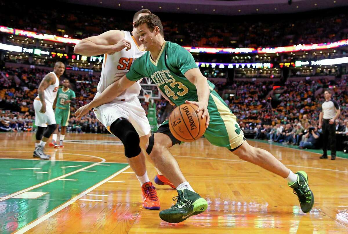 In this March 14, 2014 file photo, Boston Celtics forward Kris Humphries drives against the Phoenix Suns during a game in Boston. The Washington Wizards have acquired Humphries for a protected 2015 second-round draft pick.