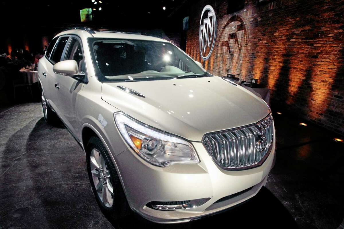 This April 3, 2012 file photo shows the 2013 Buick Enclave as it is unveiled at a news conference ahead of the New York International Car Show, in New York. General Motors on Tuesday, May 20, 2014 announced the recall of 2.4 million vehicles in the U.S., including the 2013 Enclave and other full-size crossovers from the 2009-2014 model years, as part of a broader effort to resolve outstanding safety issues more quickly. (AP Photo/Mary Altaffer, File)