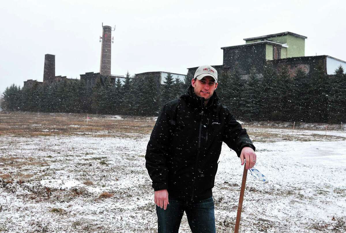 Ed Crowley Jr. stands in the field on Maple Street in Indian Neck where he and his family are planning to open a brewery.