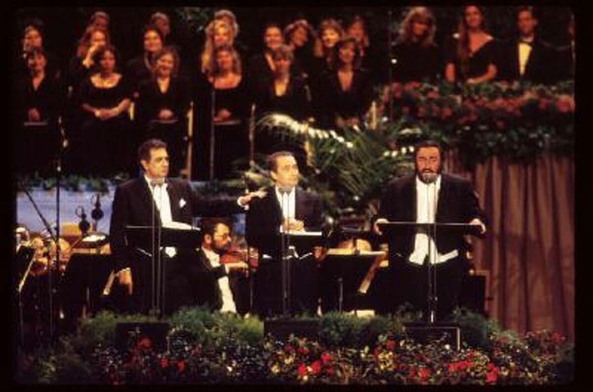 Singers Placido Domingo, Jose Carreras and Luciano Pavarotti (from left to right) perform in Dodgers Stadium July 16, 1994 in Los Angeles, CA. The trio, known as 'The Three Tenors,' performed to commemorate the end of the 1994 World Cup soccer tournament, which was the first to be held in the US.