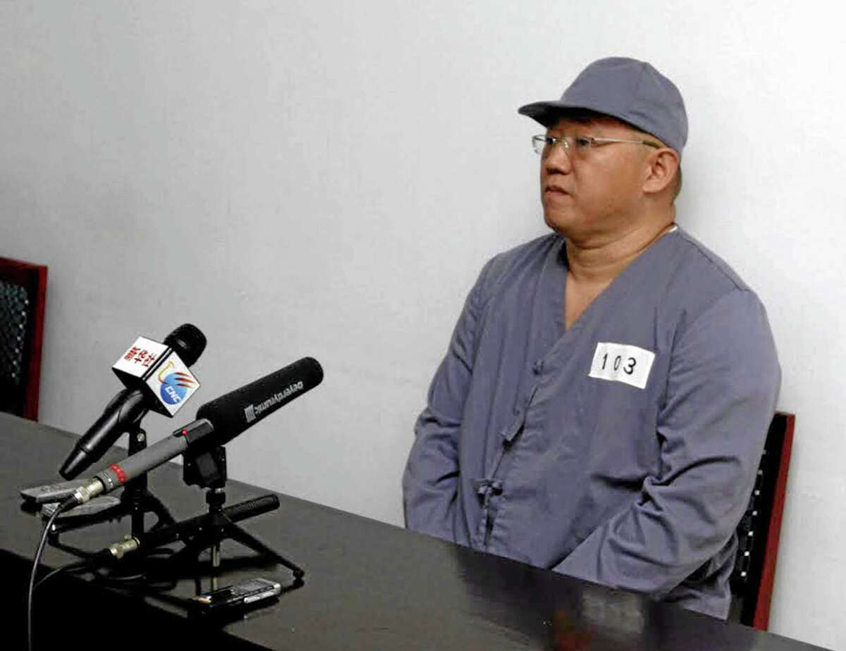 American missionary Kenneth Bae speaks to reporters at Pyongyang Friendship Hospital in Pyongyang Monday, Jan. 20, 2014. Bae, 45, who has been jailed in North Korea for more than a year, appealed for the U.S. to do its best to secure his release. (AP Photo/Kim Kwang Hyon)