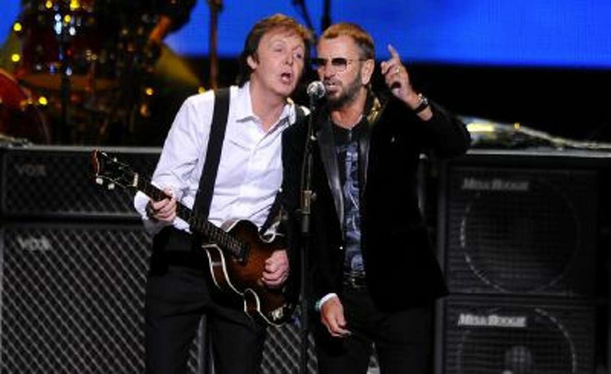 his April 4, 2009 file photo shows Paul McCartney, left, and Ringo Starr performing at the Change Begins Within Concert in New York. The Recording Academy announced Tuesday, Jan 14, 2014, that both McCartney and Starr will perform at the Jan. 26 Grammy awards show. The Beatles will be honored at the Academy?s Special Merits Awards a day before, and a day after the big show, the iconic group will be the center of a performance special featuring Eurythmics and other acts playing Beatles hits.