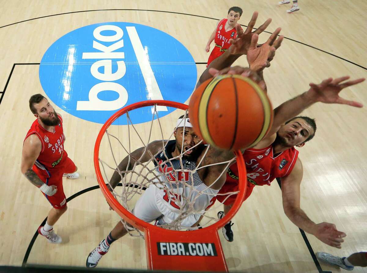 DeMarcus Cousins, center, dunks during the championship game of the Basketball World Cup against Serbia on Sunday.