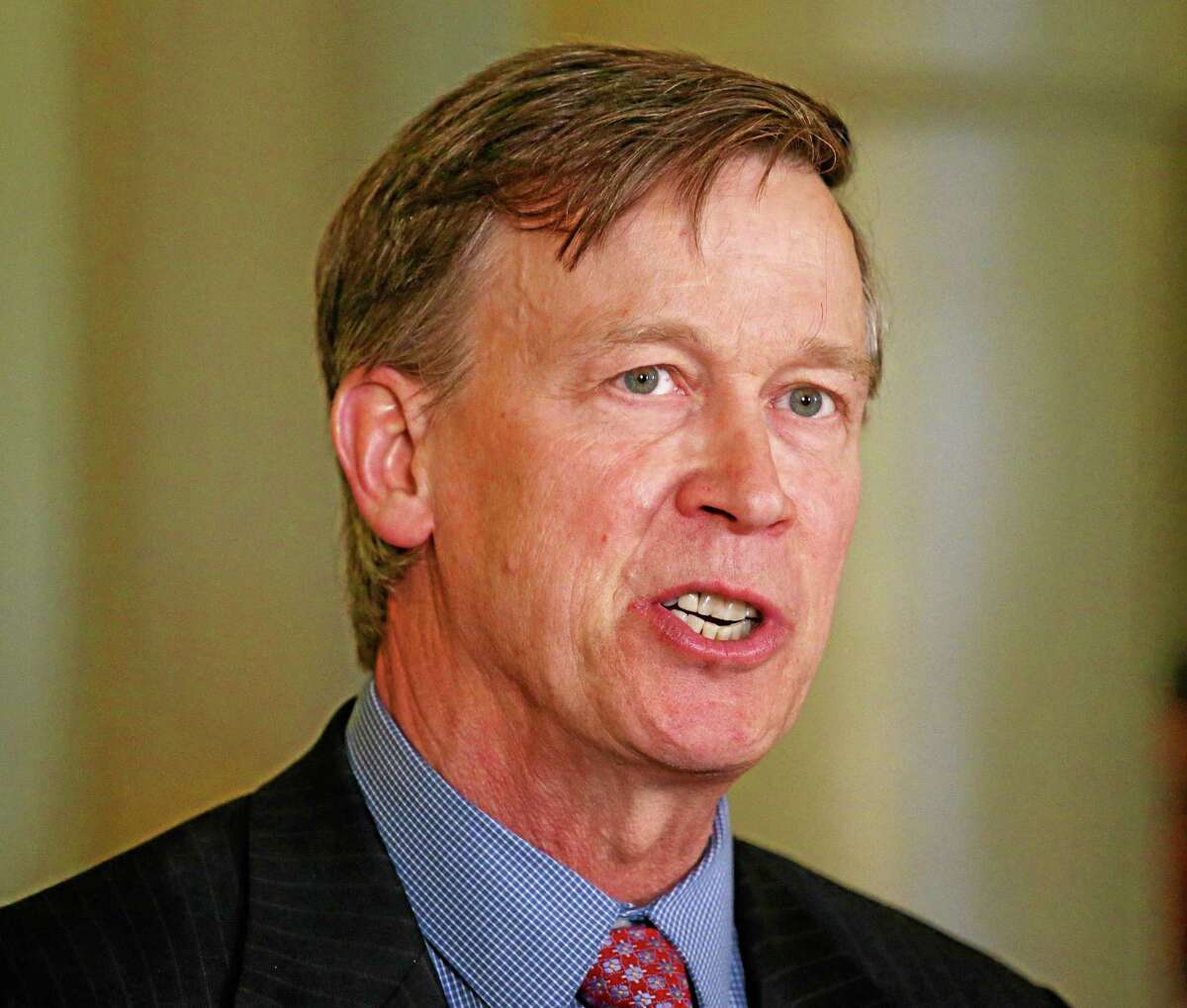 FILE - Colorado Gov. John Hickenlooper speaks at a news conference at the Capitol in Denver in this Wednesday, May 22, 2013 file photo. Hickenlooper Saturday afternoon May 17, 2014 will sign Colorado's "Right To Try" bill, which was passed unanimously in the state Legislature. The "Right To Try" law allows terminally ill patients to obtain experimental drugs without getting federal approval. The bill doesn't require drug companies to provide any drug outside federal parameters, and there's no indication pharmaceutical companies will do so. (AP Photo/Ed Andrieski, File)