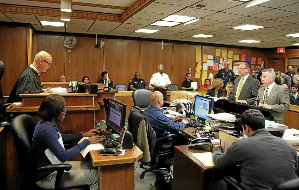 Judge William Altfield, far left, presides in court as assistant state attorney David Gilbert, left, and defense attorney Mark Shapiro, right, present their case during a hearing to determine whether pop star Justin Bieber will be tried on charges of driving under the influence and resisting arrest, Wednesday, July 16, 2014, in Miami. Bieber was arrested Jan. 23 in Miami Beach after what police described as an illegal street race between Bieber and a friend. Bieber did not attend the hearing. Another hearing was set for August 5. (AP Photo/Fernando Castells, Pool)