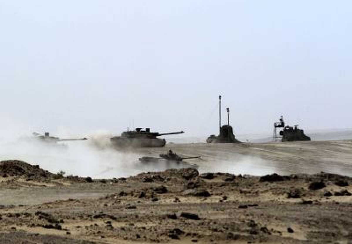 UAE tanks drive during joint military maneuvers with the French army in the desert of Abu Dhabi May 2, 2012.