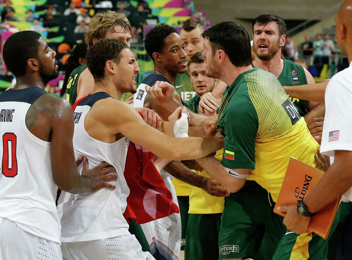 U.S. and Lithuania players scuffle after their Basketball World Cup semifinal Thursday at the Palau Sant Jordi in Barcelona, Spain.
