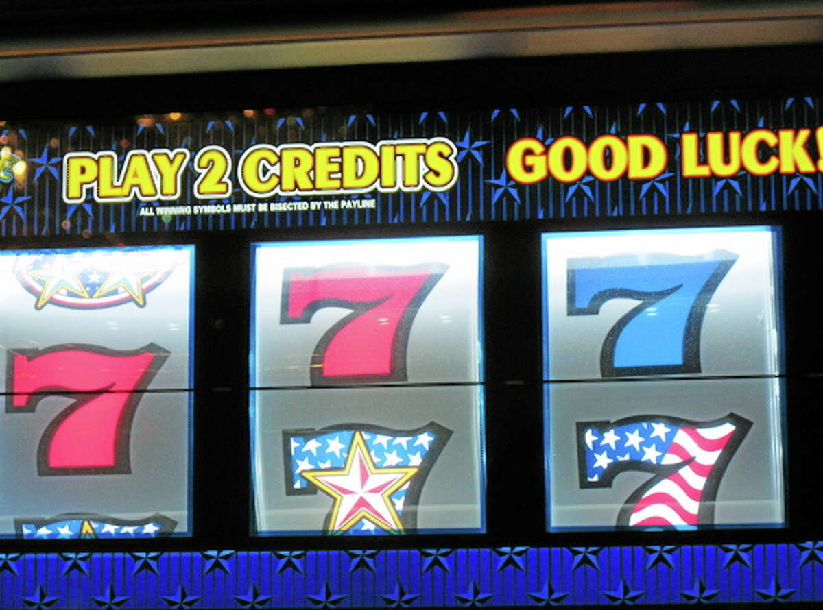 This Nov. 14, 2013 photo shows a slot machine at the Tropicana Casino and Resort in Atlantic City, N.J. The city's casinos saw their gross operating profits fall by nearly 35 percent in 2013 to $235 million, down from $360 million in 2012.(AP Photo/Wayne Parry)