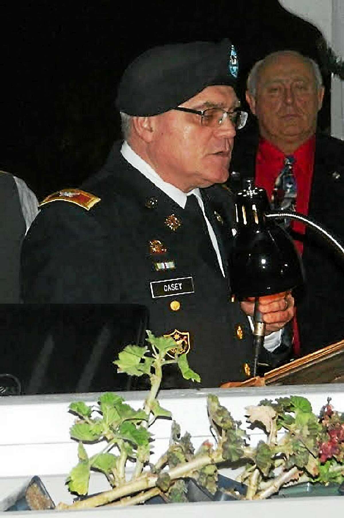 Col. Michael E. Casey of the Connecticut National Guard speaks at Tuesday night’s ceremony.